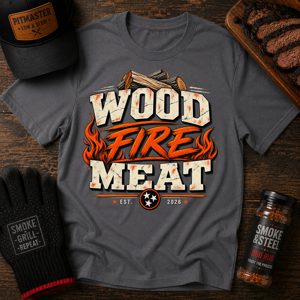 Wood Fire Meat tee featuring crossed firewood above bold lettering with flames on both sides